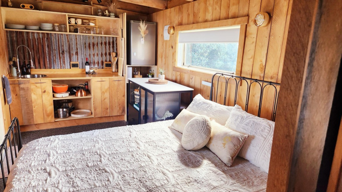 Cabin interior — queen bed and kitchenette