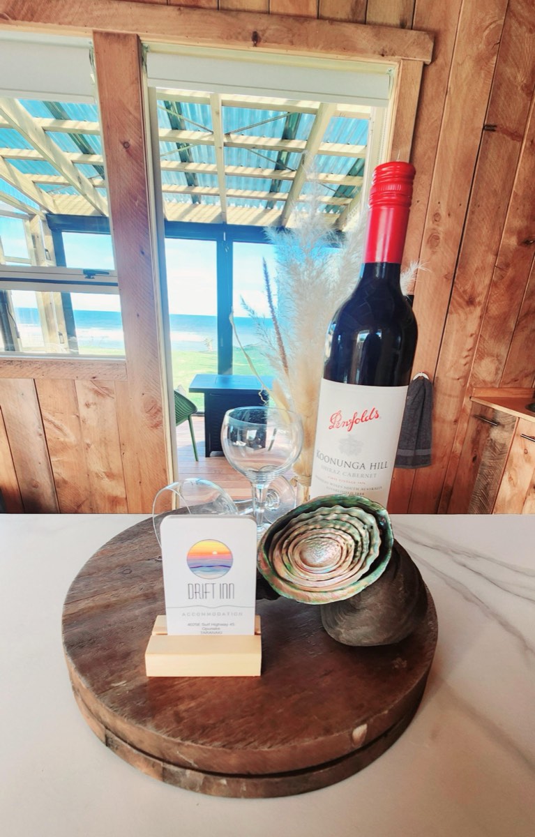 Welcome wine and paua shells on the kitchenette bench
