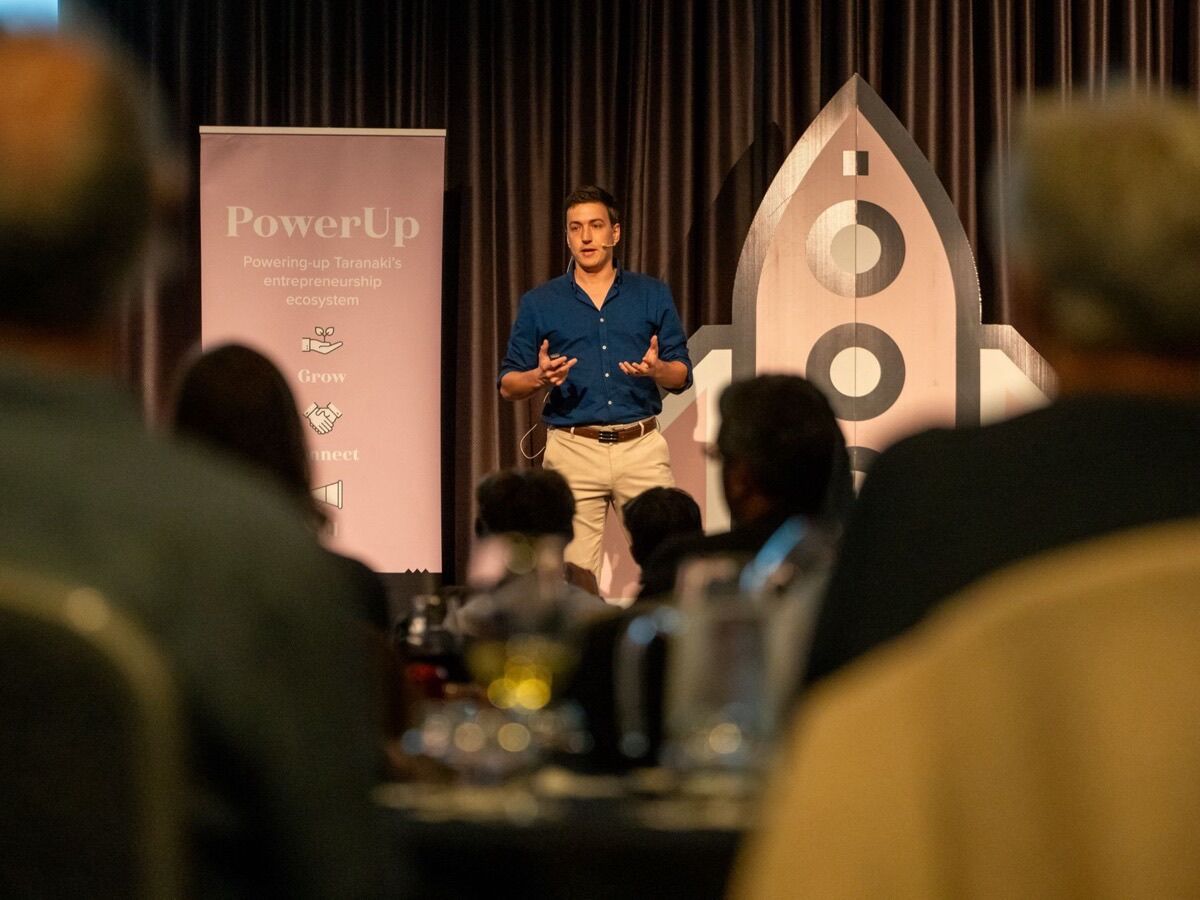 Xavier, who builds TipJar.nz, on stage at PowerUp Taranaki in New Plymouth