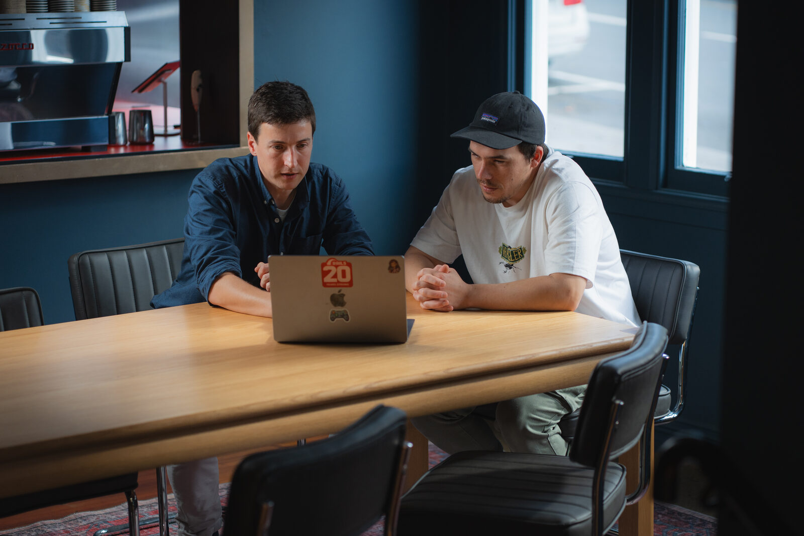 Xavier working through a project with a client at the XAVER office table